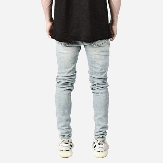 Men's ripped slim fit skinny jeans in light blue, back view