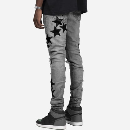 Men's star patch distressed skinny jeans in grey, back view