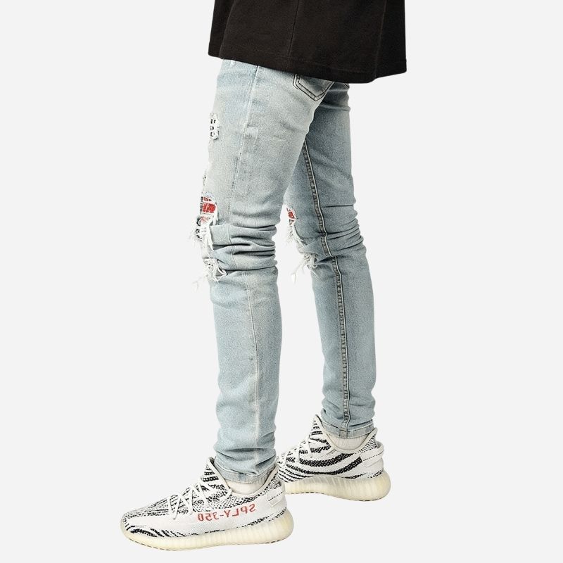 Men's ripped slim fit skinny jeans in light blue, side view