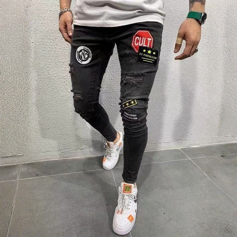 Men's ripped patch embroidered slim stretch skinny jeans in black, front view