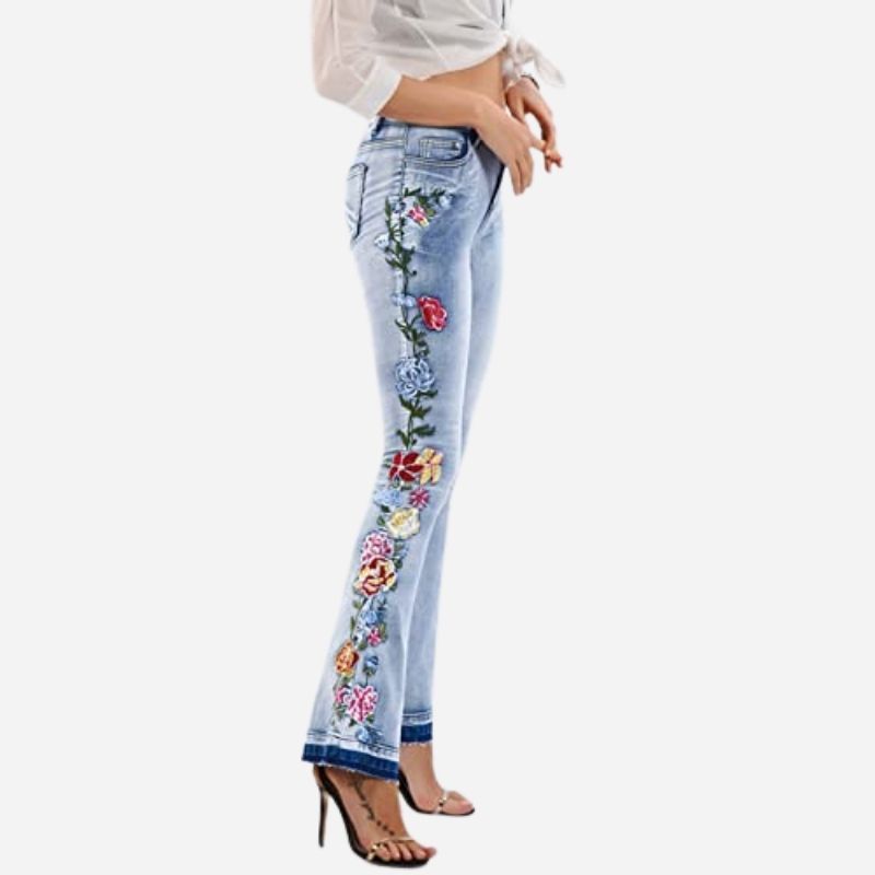 Women's floral embroidered flare jeans, side view
