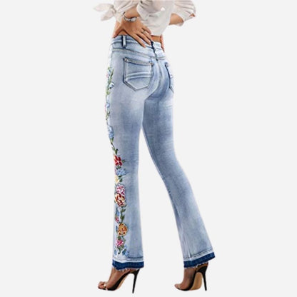 Women's floral embroidered flare jeans, back view
