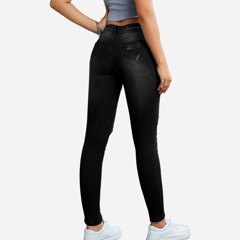 Women's ripped skinny jeans star print denim pants in black, back view