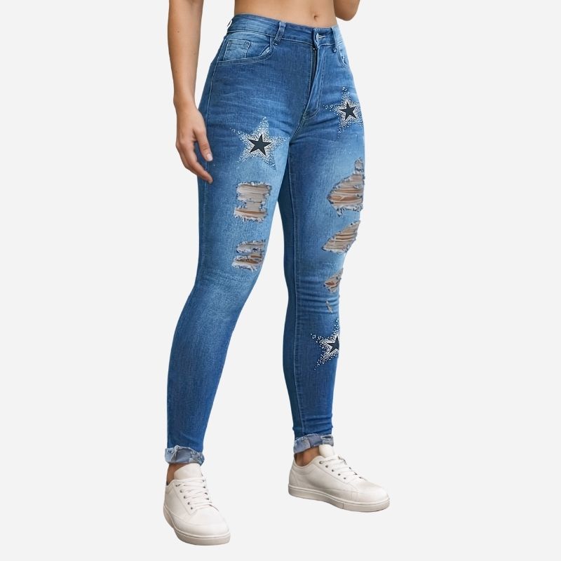 Women's ripped skinny jeans star print denim pants in blue, side view