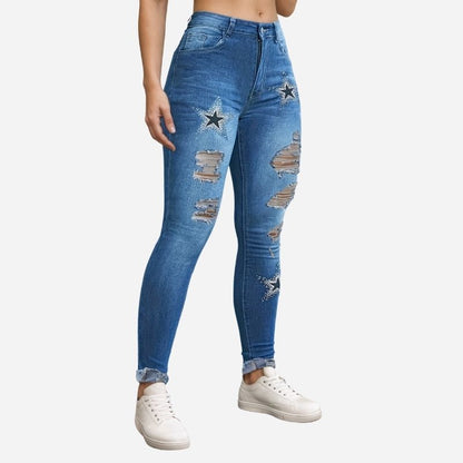 Women's ripped skinny jeans star print denim pants in blue, side view