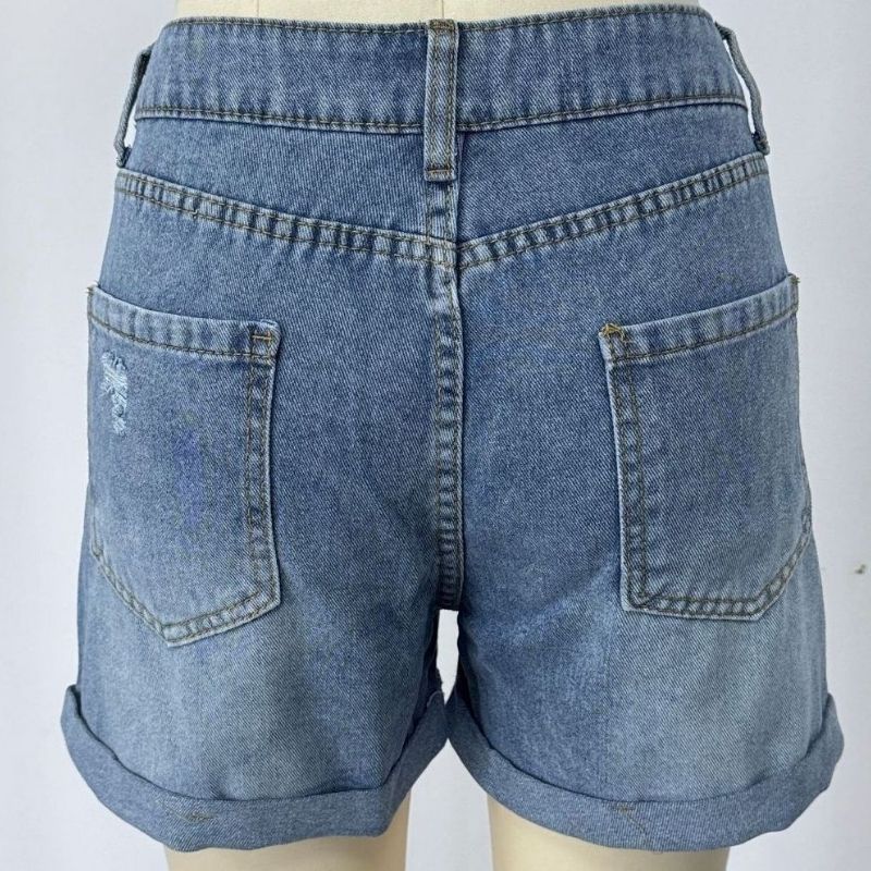 Women's Ripped Denim Shorts in blue, back view